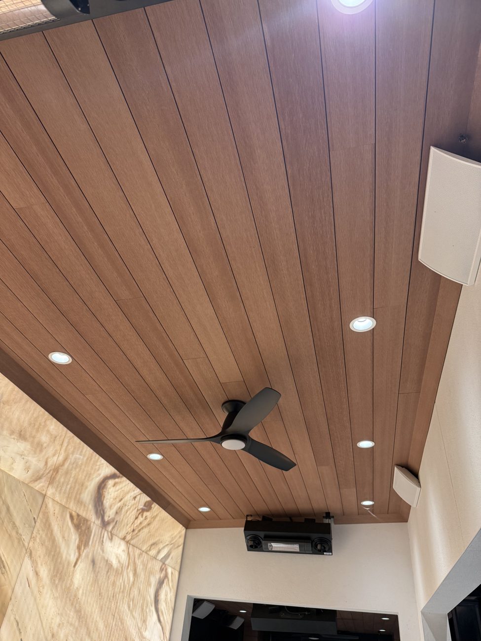 Custom outdoor smart lighting — wood-slat ceiling with integrated recessed layout
