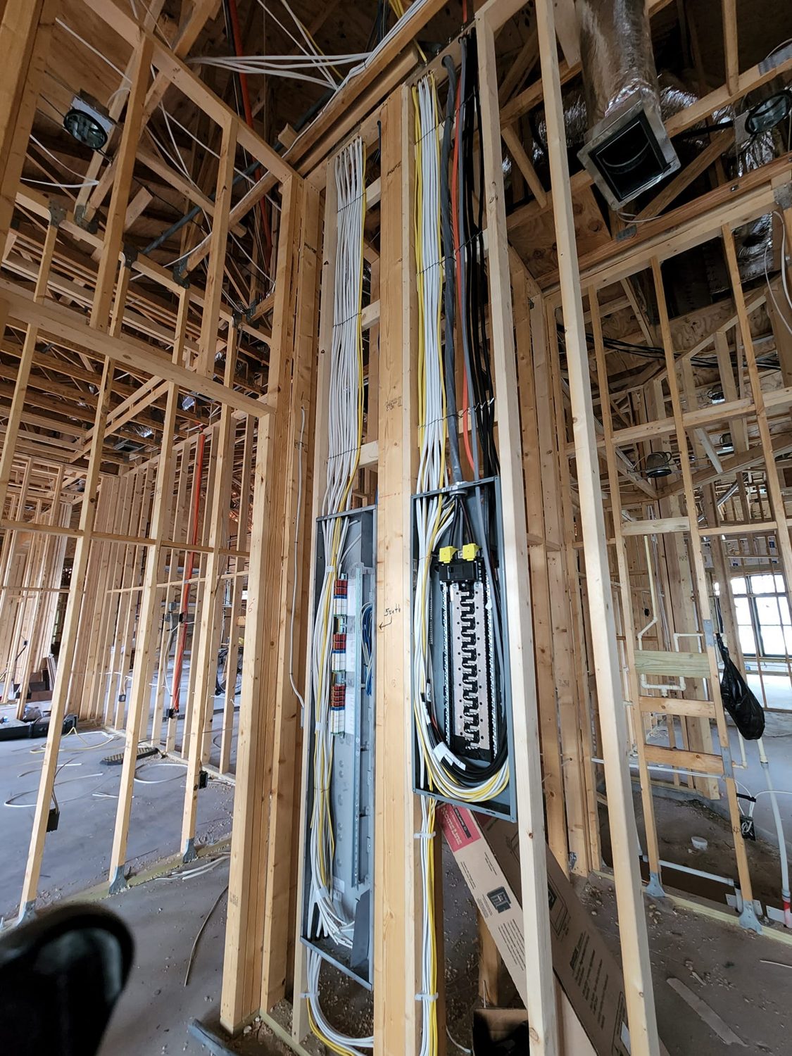 Structured smart-home wiring and control infrastructure roughed in at framing